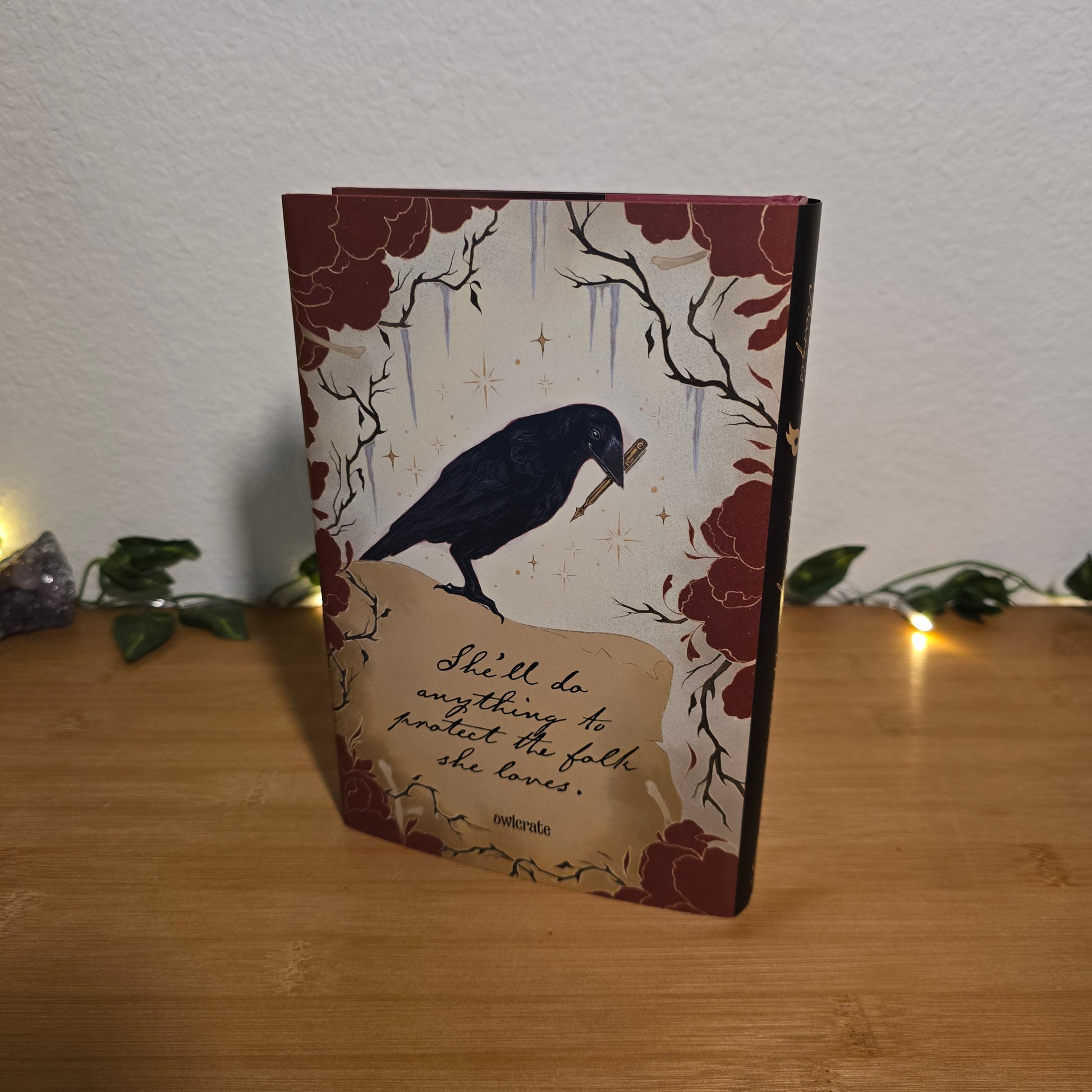 Decorative notebook with a bird illustration on a wooden surface
